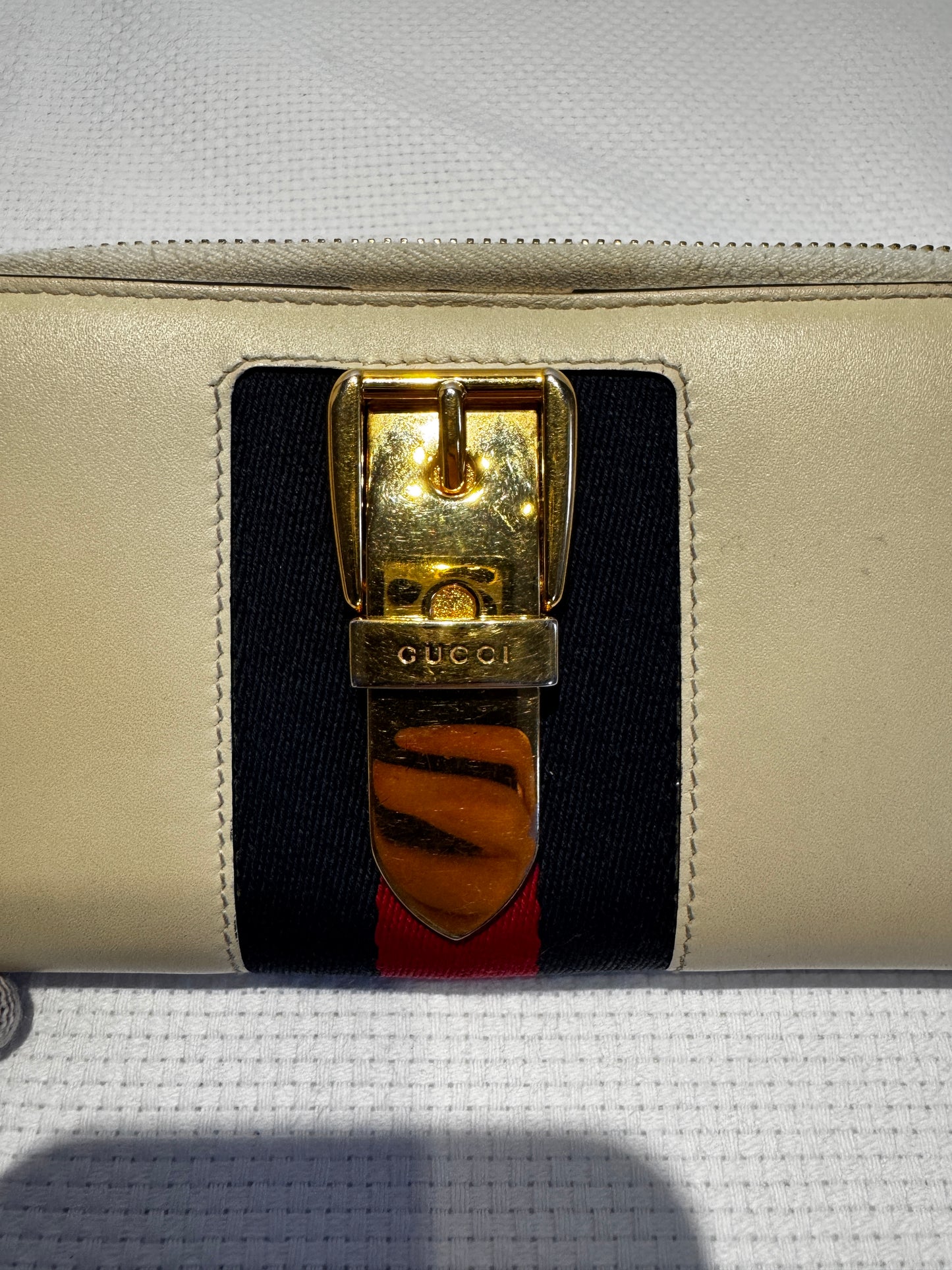 GUCCI Sylvie cream leather and stripe gold buckle wallet